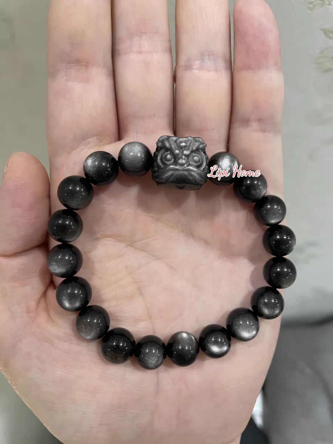 Mặt dây chuyền charm đá obsidian điêu khắc đầu lân