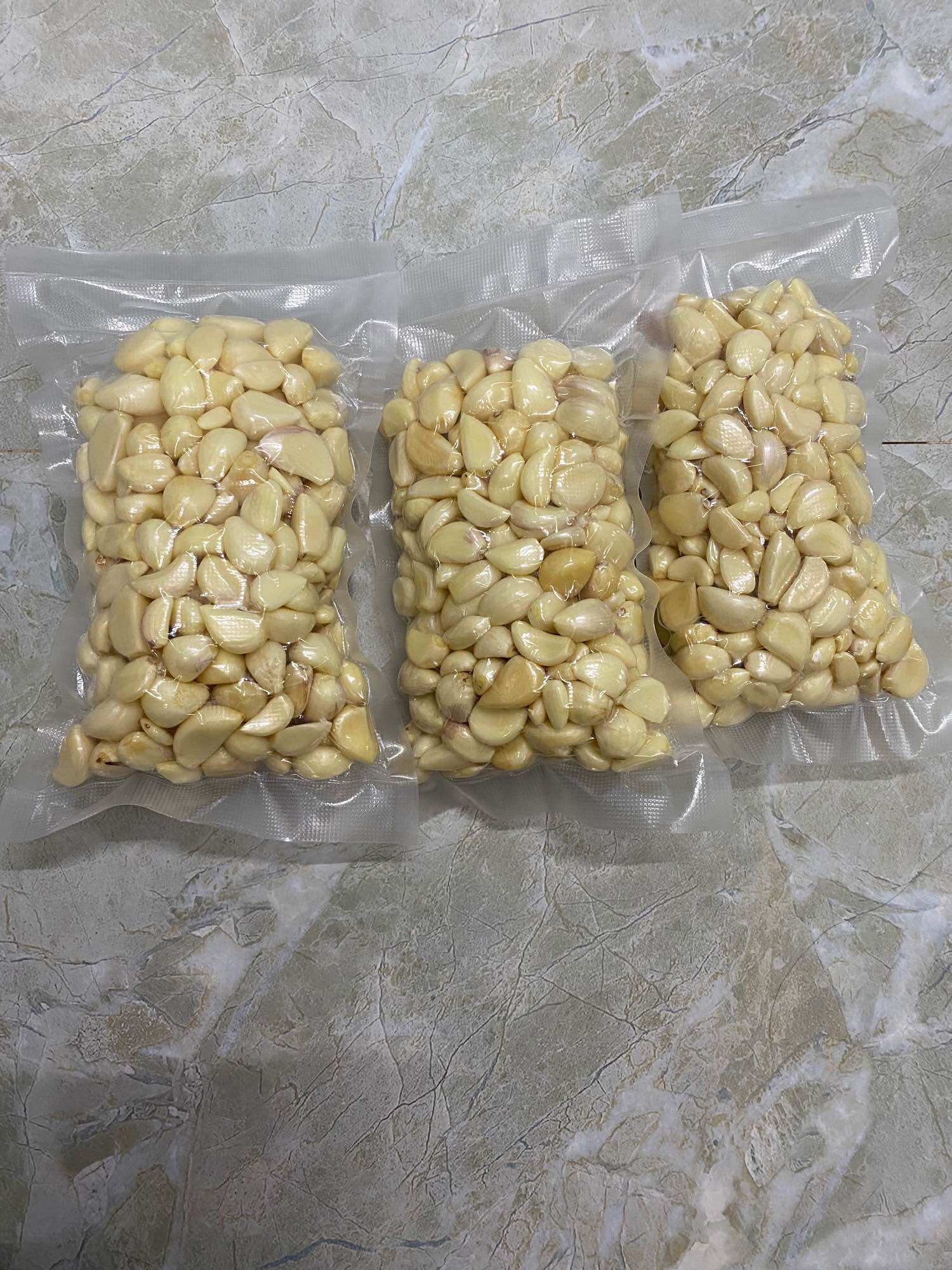 Tỏi bóc sẵn túi 0,5kg( tặng 1 bàn chải đánh răng)