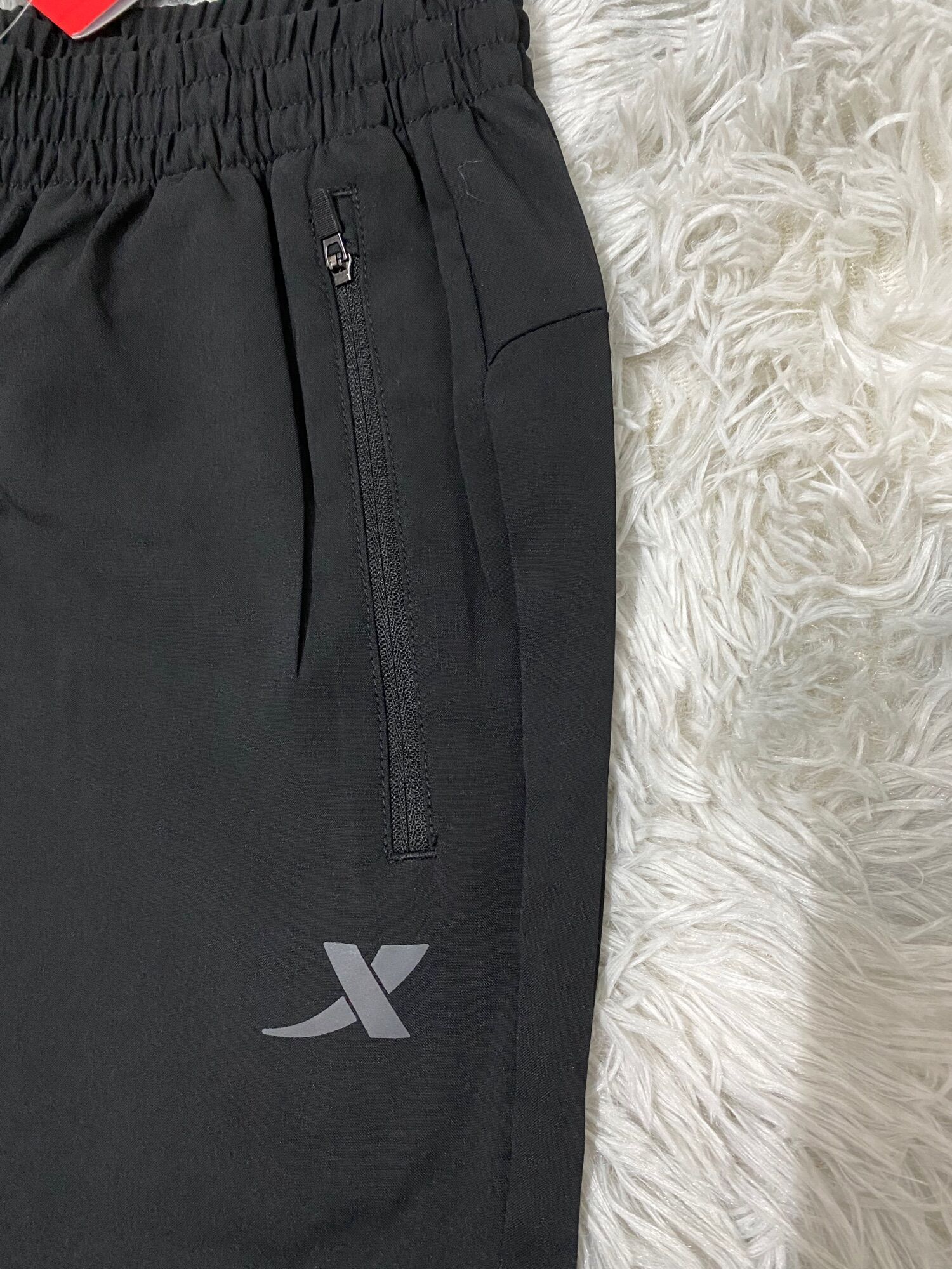 (Size L) quần gió nam Xtep 979229985039