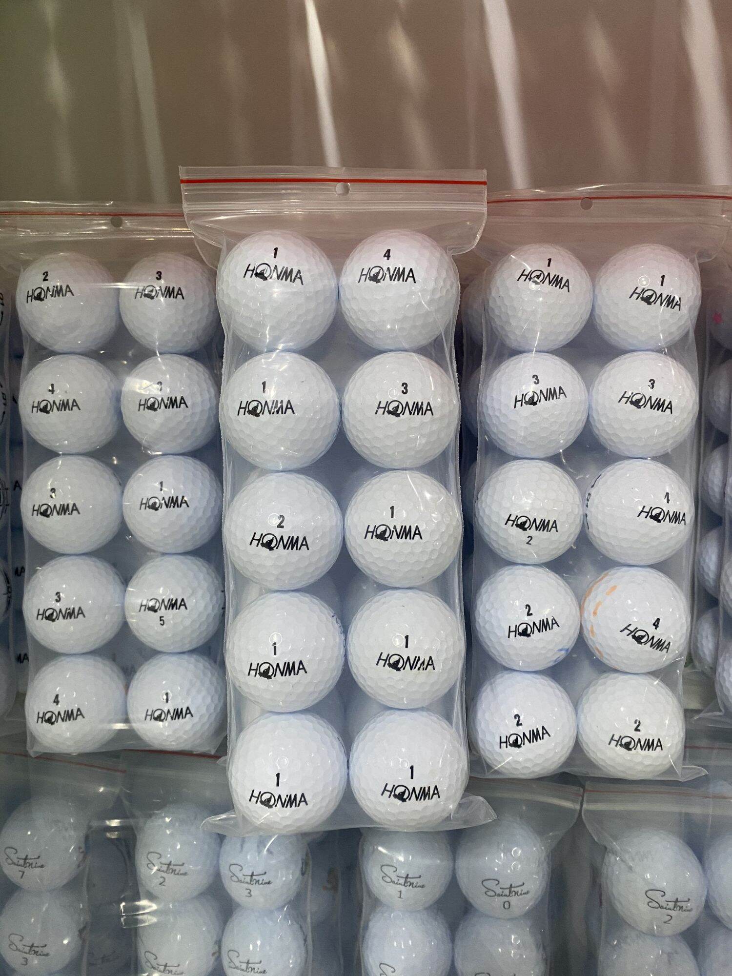 Bóng golf honma màu trắng độ mới 98%