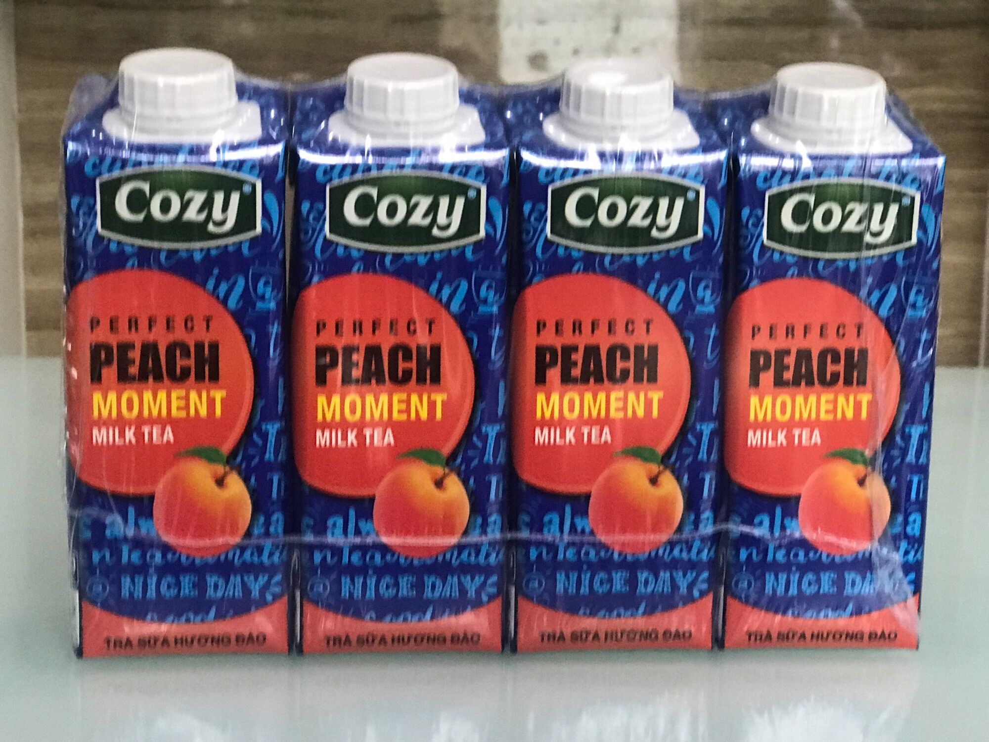 1 lốc trà sữa đào cozy 4 hộp *225 ml