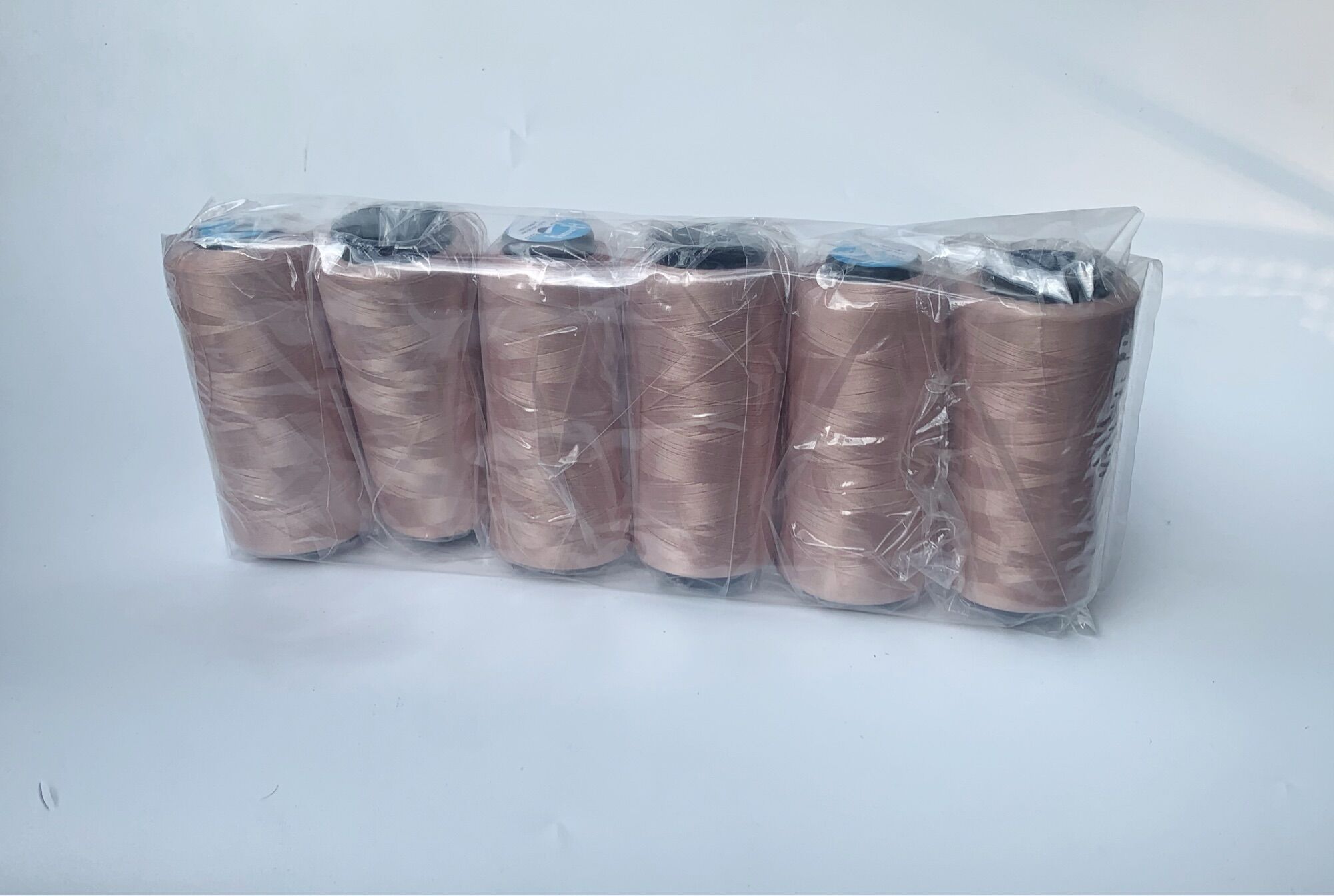 Vỉ 6 cuộn chỉ tơ vắt sổ màu nâu nhạt