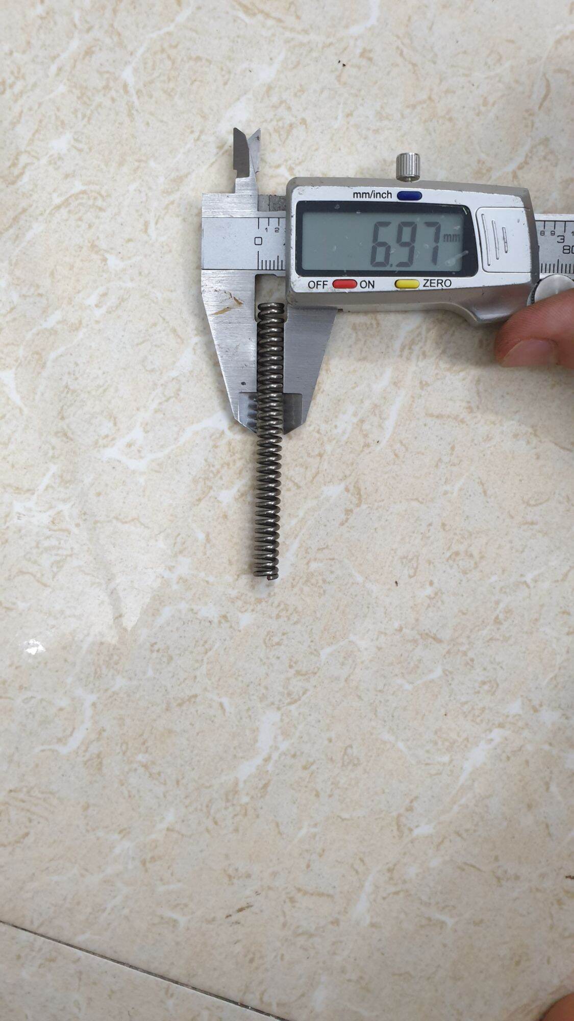 Lò xo phi 7 sợi 1.3 dài 6cm và 7cm