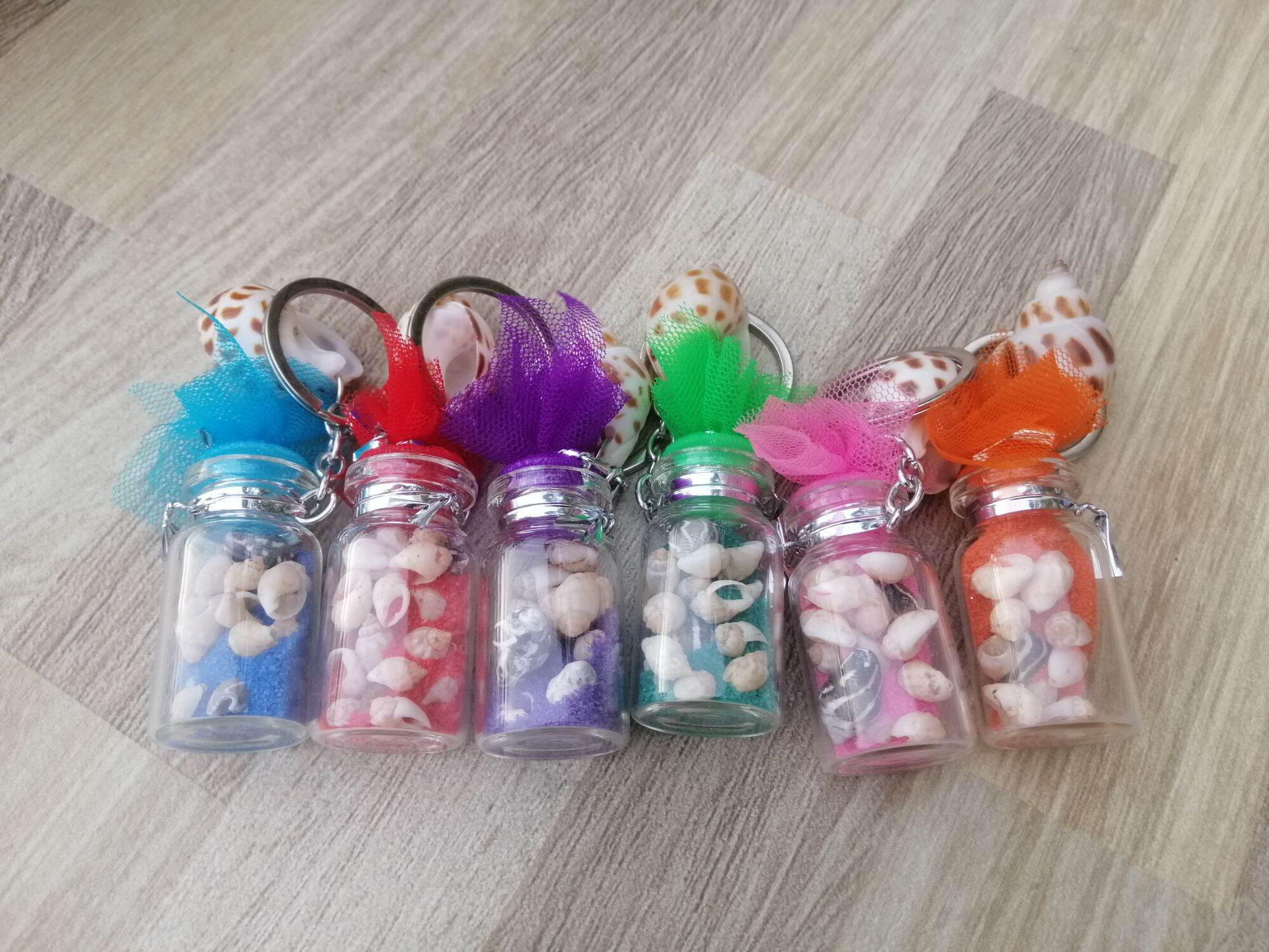 MÓC KHÓA CHAI THỦY TINH ĐỰNG ỐC SIZE 2*4 CM