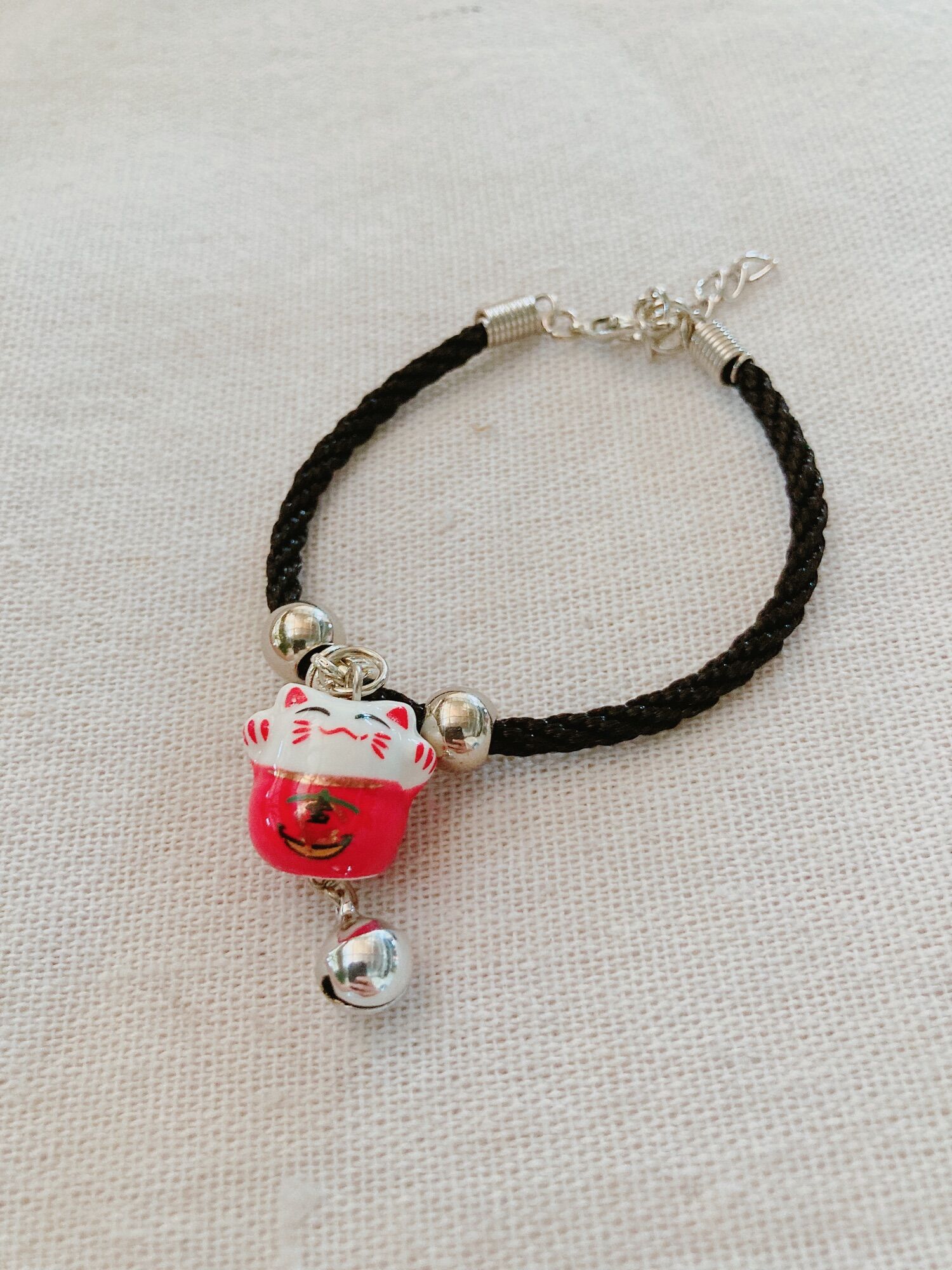 Vòng tay mèo maneki neko gốm sứ