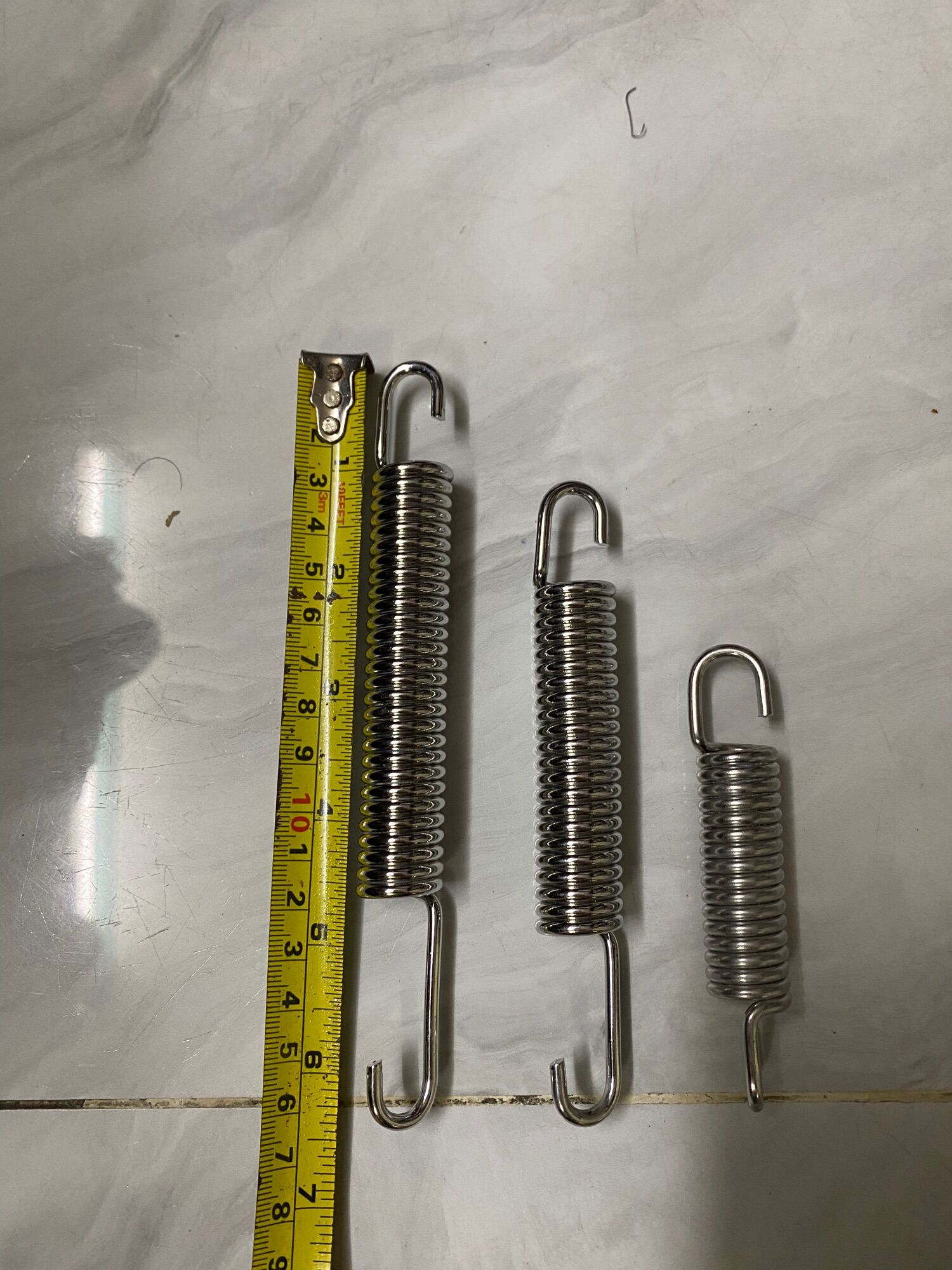 lò xo chống đứng inox gắn xe máy