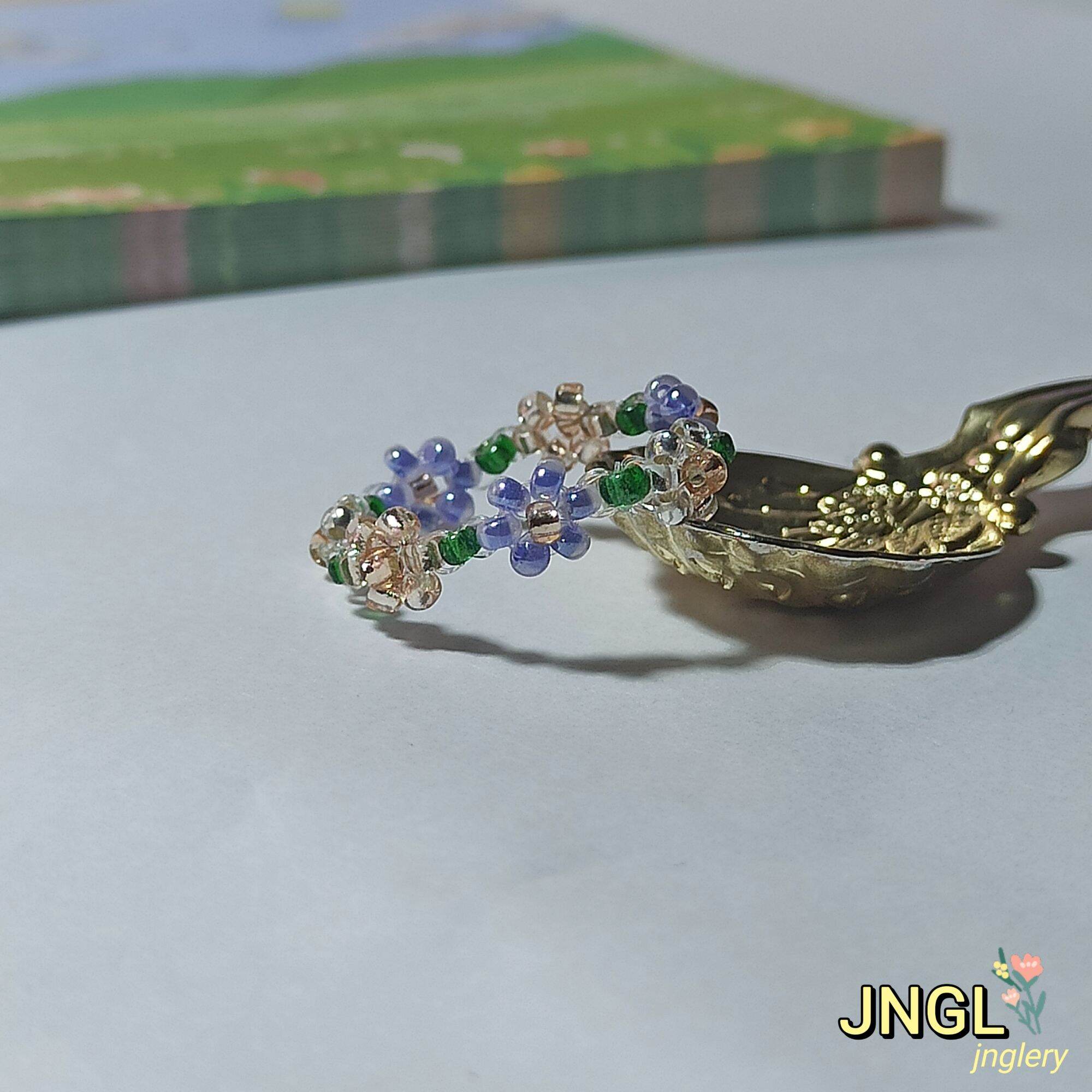 Nhẫn hoa hạt cườm nơ thỏ
