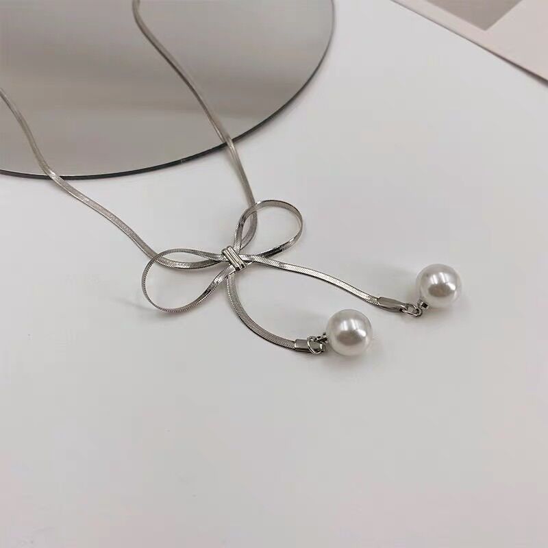 Choker titan dây mảnh  nơ ngọc (zl)(màu trắng)