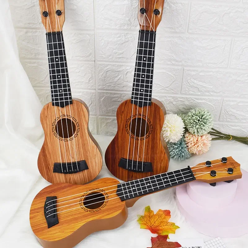 Đàn Guitar Mini 4 Dây Đàn Ukulele Đồ Chơi Nhạc Cụ Dành Cho Trẻ Em Người Mới Bắt Đầu Giáo Dục Sớm Chất Liệu Gỗ Trẻ Em Học Tập Và Tập Thể Dục loại