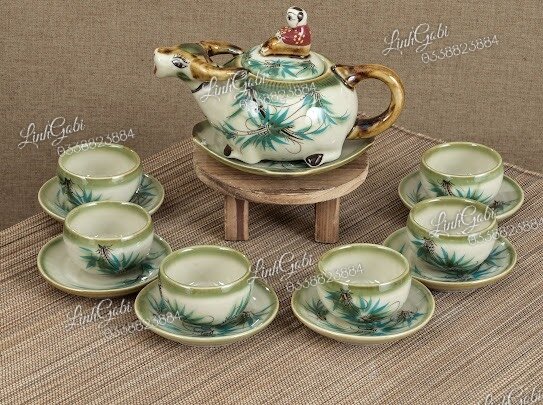 Bộ ấm trà trẻ trăn trâu , ấm chén bát tràng cao cấp