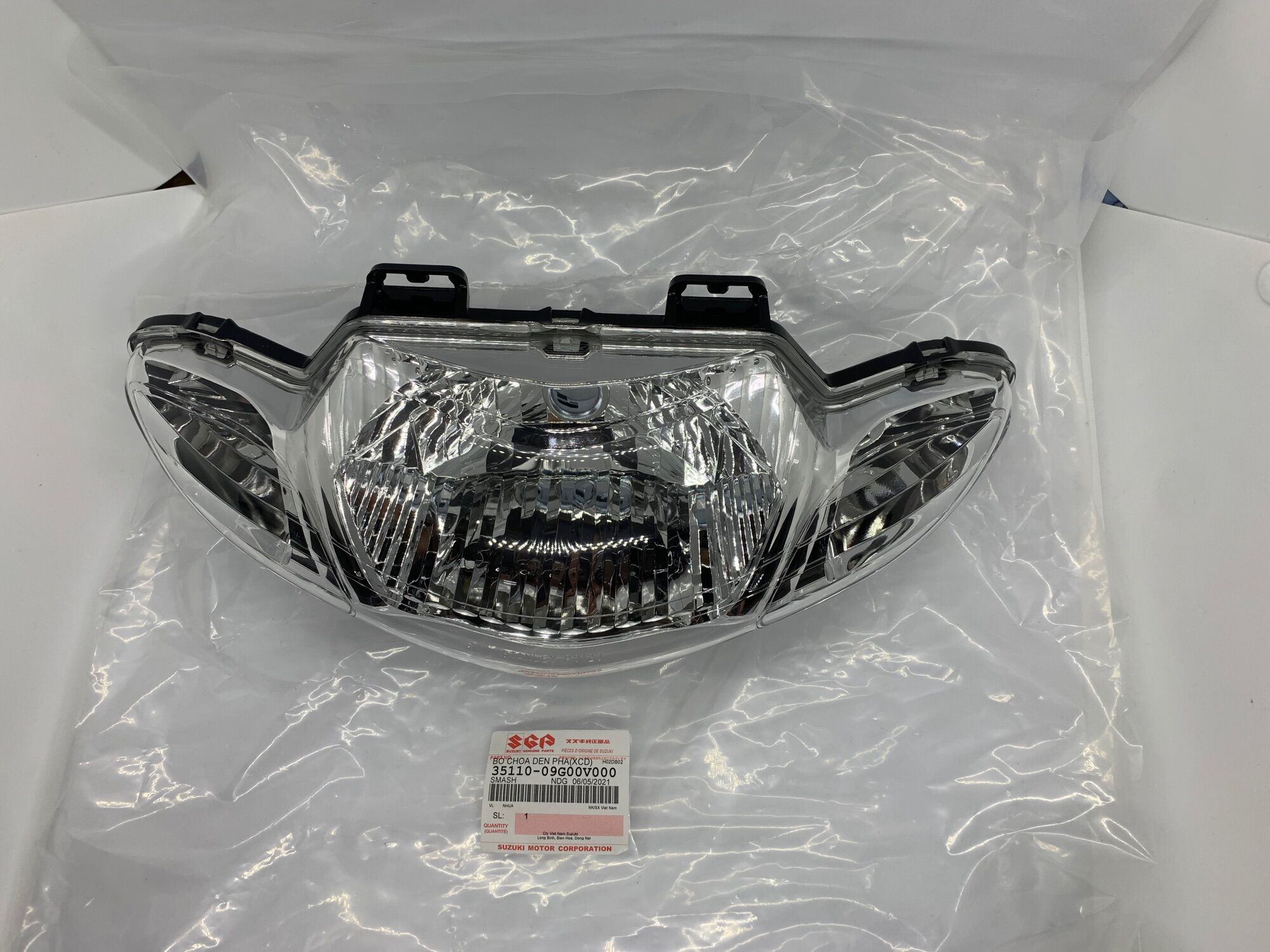 Pha đèn smash 110 suzuki