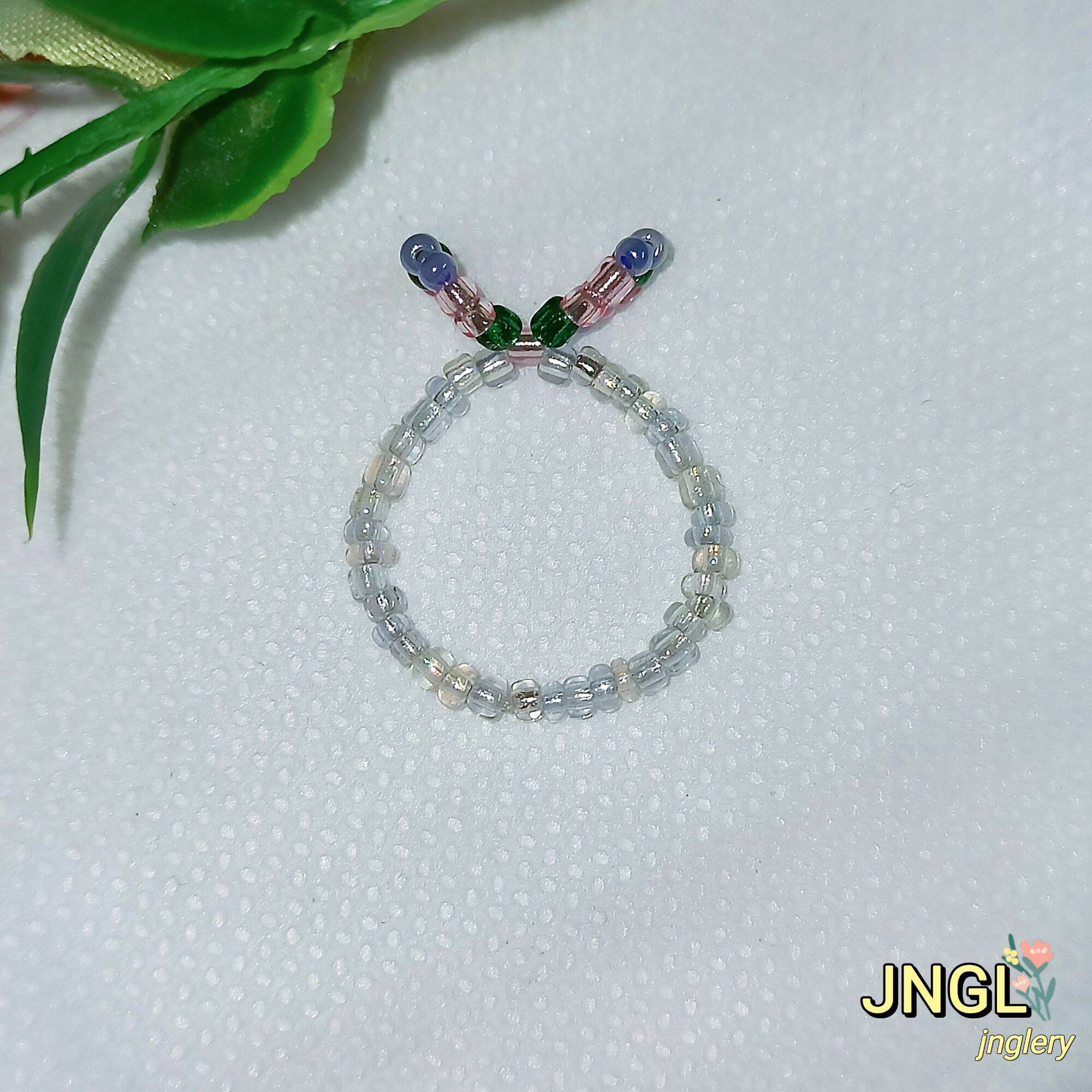 Nhẫn hoa hạt cườm nơ thỏ