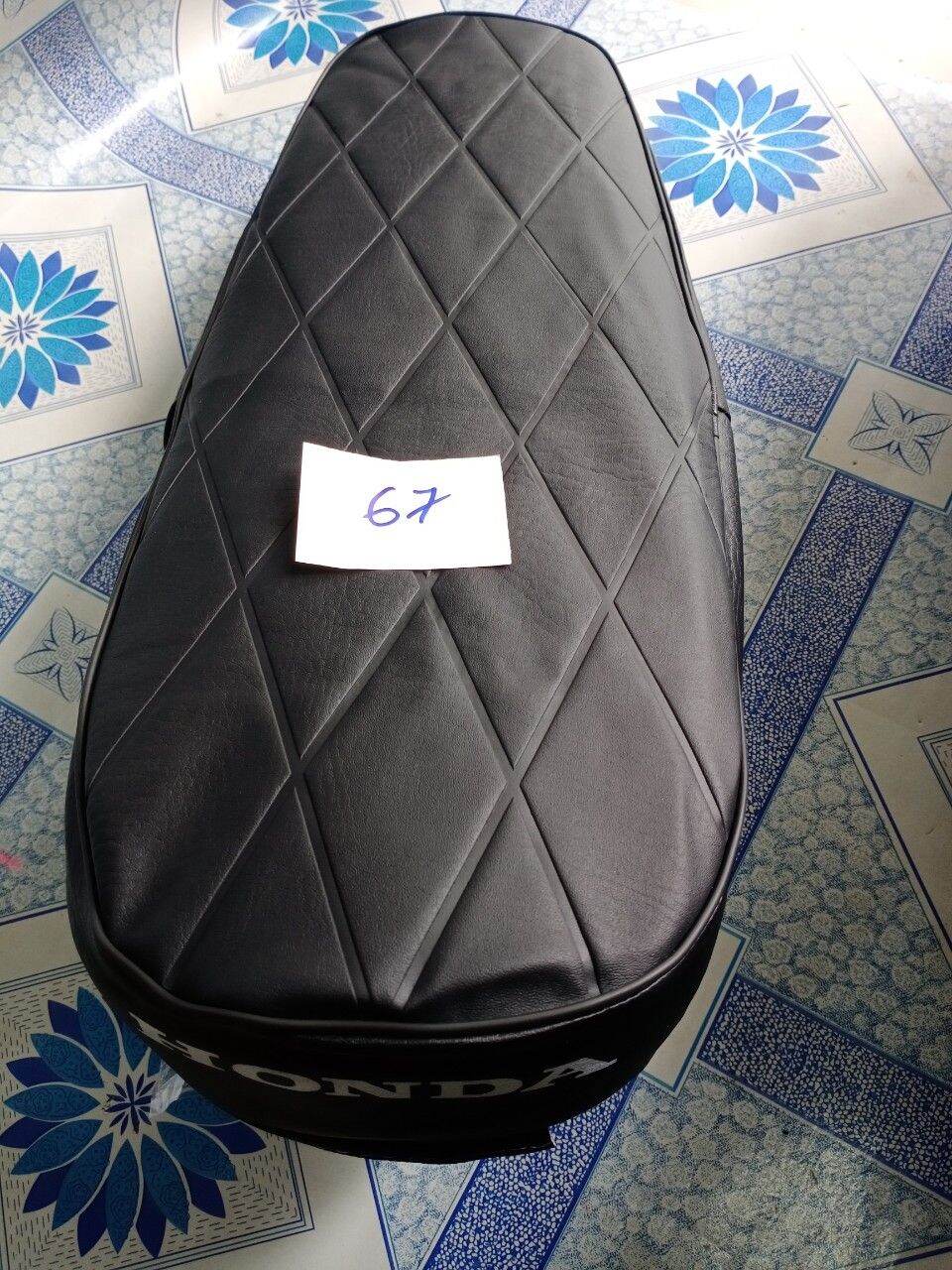Áo yên xe 67 đời cũ
