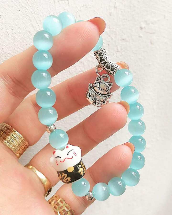 Chuỗi vòng tay đá mắt mèo charm mèo Thần Tài 8ly
