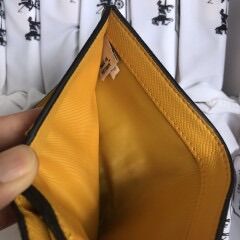 Ví cầm tay mini da thật Coach