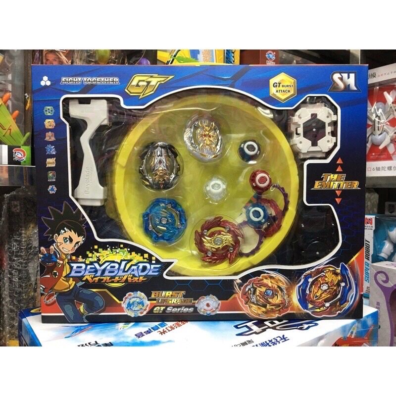 Hộp đồ chơi có 4 con quay beyblade kèm sàn thi đấu.