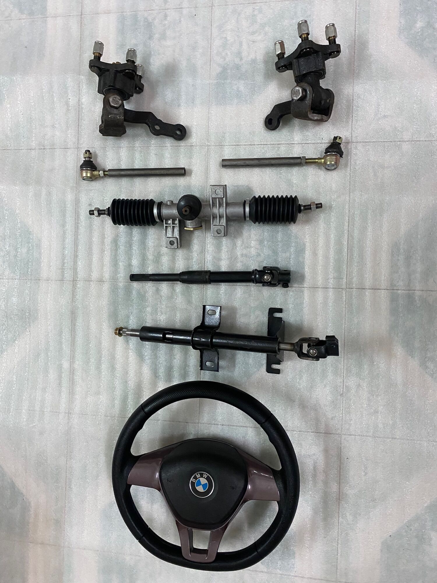 Hệ thống lái vô lăng xe 4 bánh,mai ơ tim ốc đo vuông 7cm,chéo 10cm,dùng chế xe 4 bánh lái vô lăng