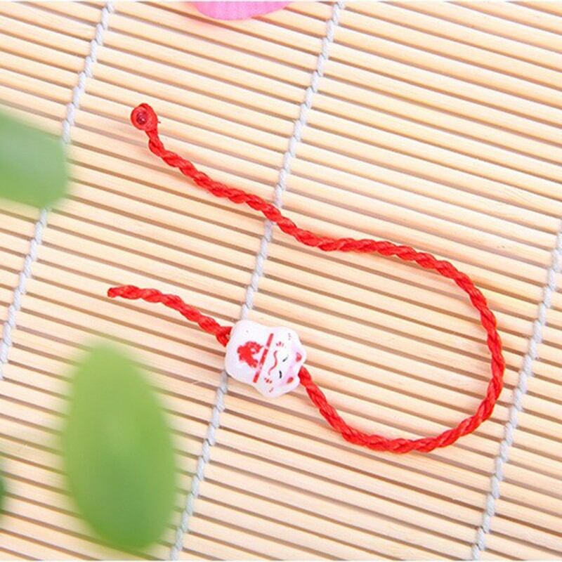 Vòng mèo thần tài gốm sứ chỉ đỏ may mắn