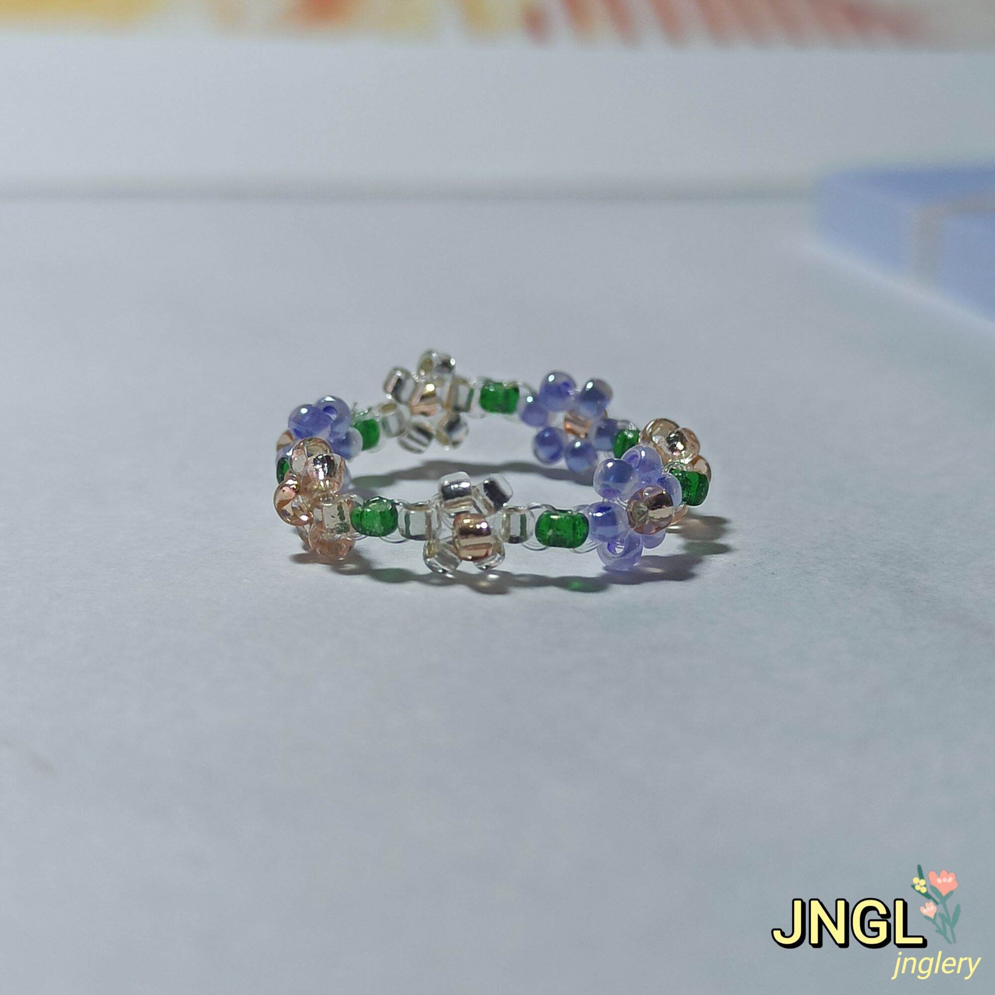Nhẫn hoa hạt cườm nơ thỏ