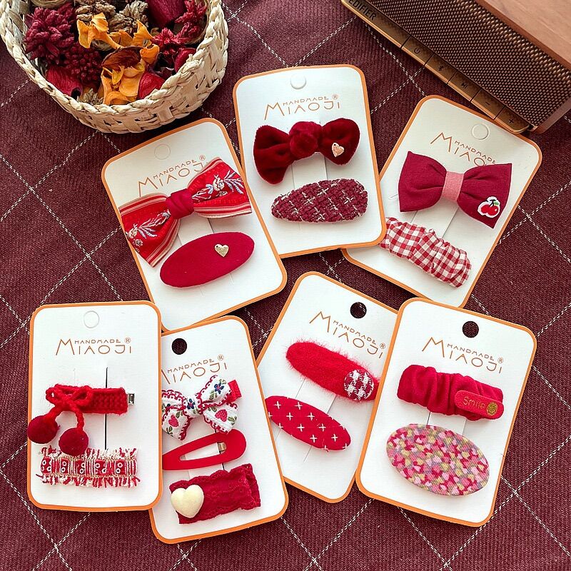 Set kẹp tóc màu đỏ lễ Tết cho bé gái