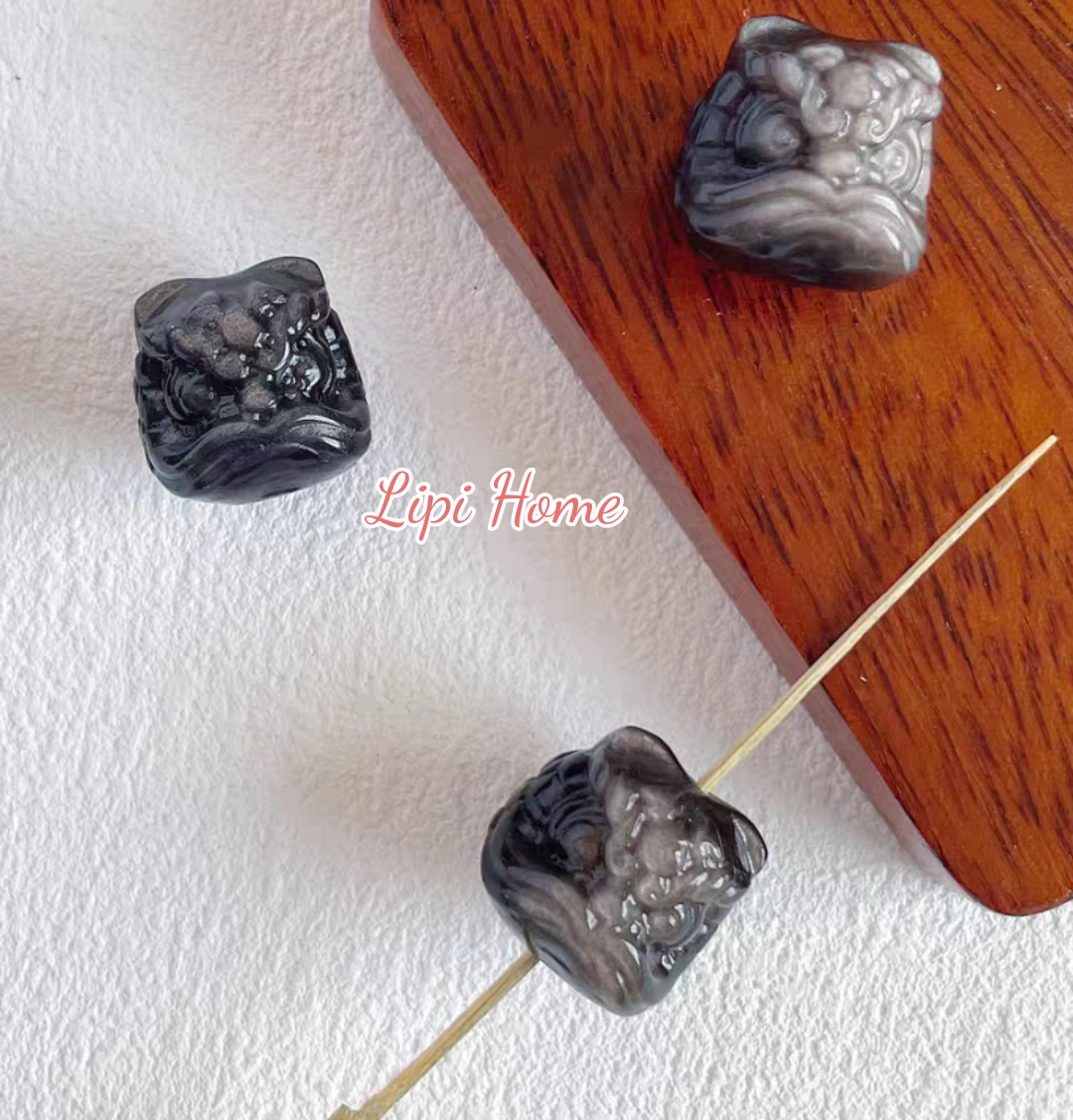 Mặt dây chuyền charm đá obsidian điêu khắc đầu lân