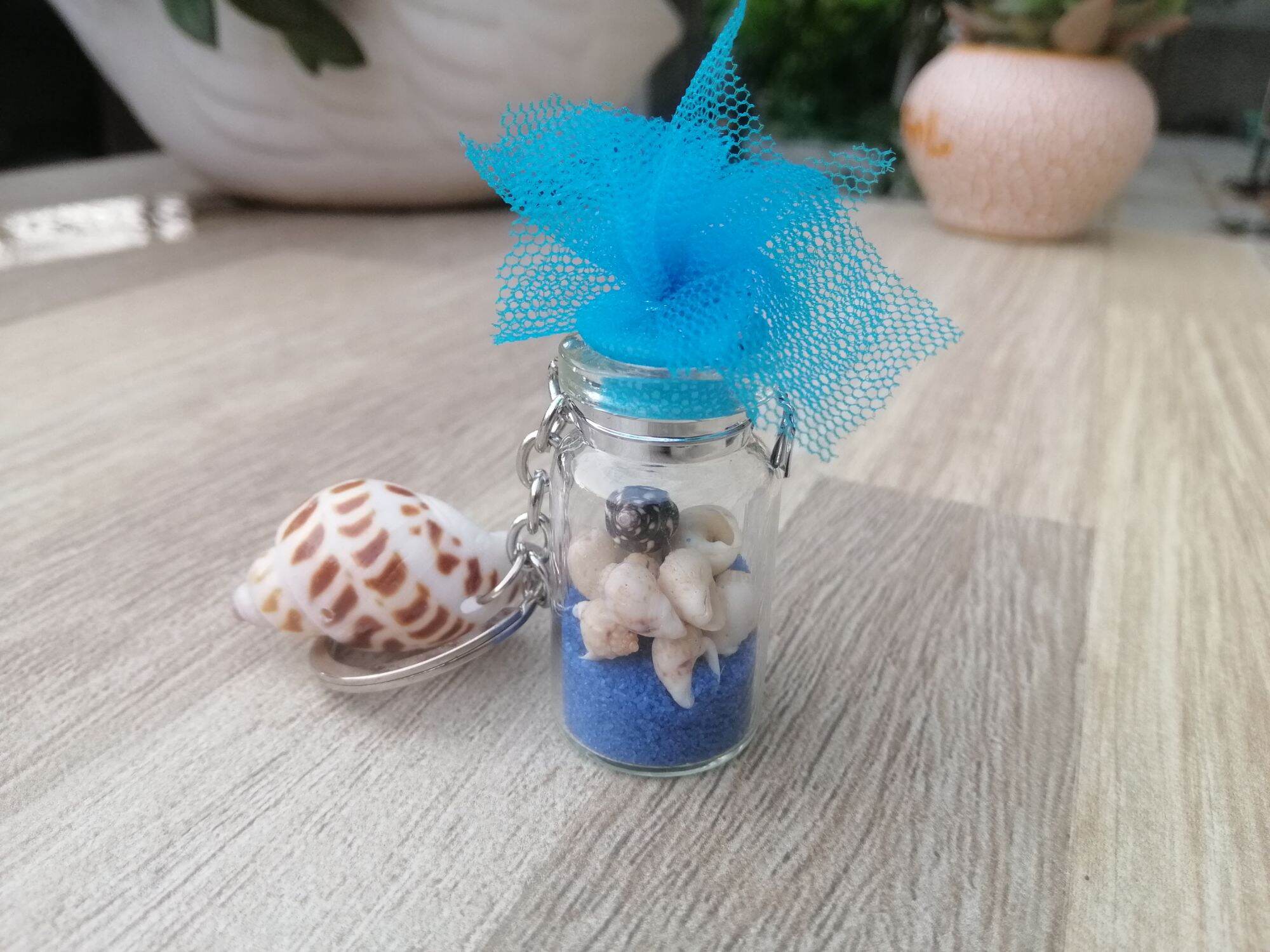 MÓC KHÓA CHAI THỦY TINH ĐỰNG ỐC SIZE 2*4 CM