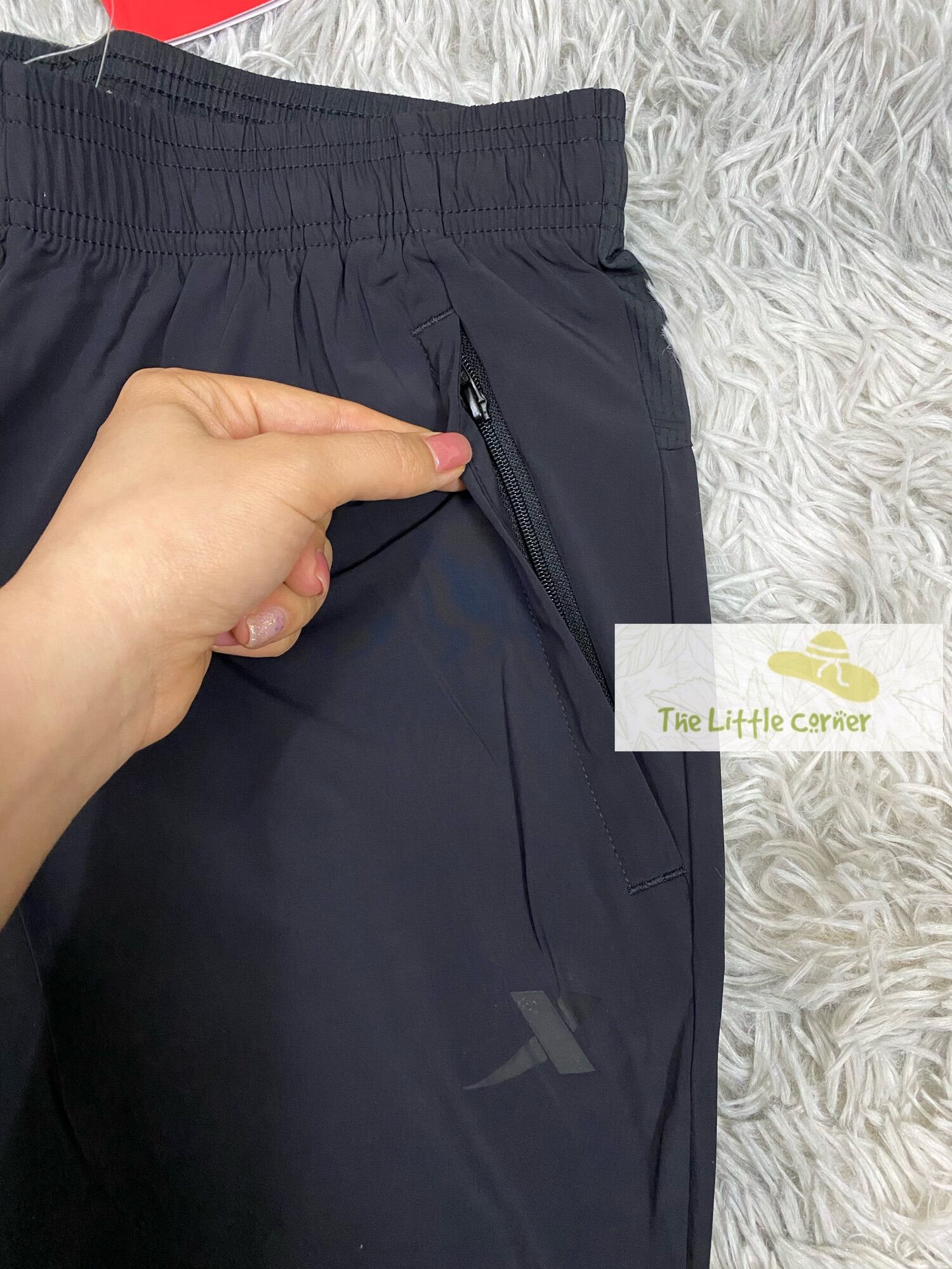 Quần short gió nam Xtep 979229975041